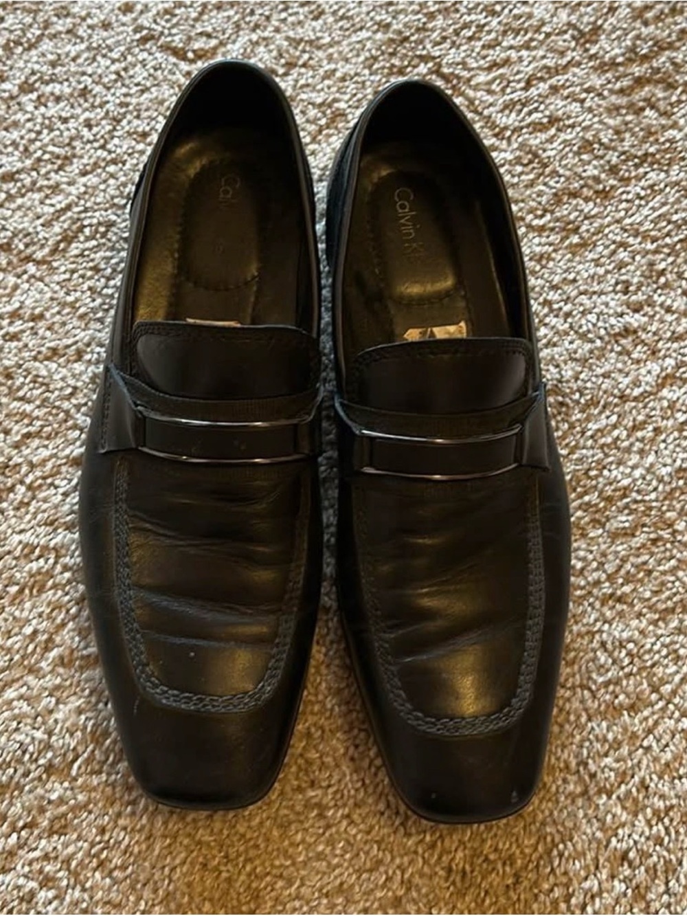 Calvin Klein Men’s Black Leather Slip-On Loafers with Metal Accent